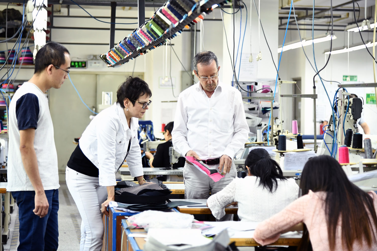 Sample room of Starry in China, managing director, designer and sample room manager talking about a bag part