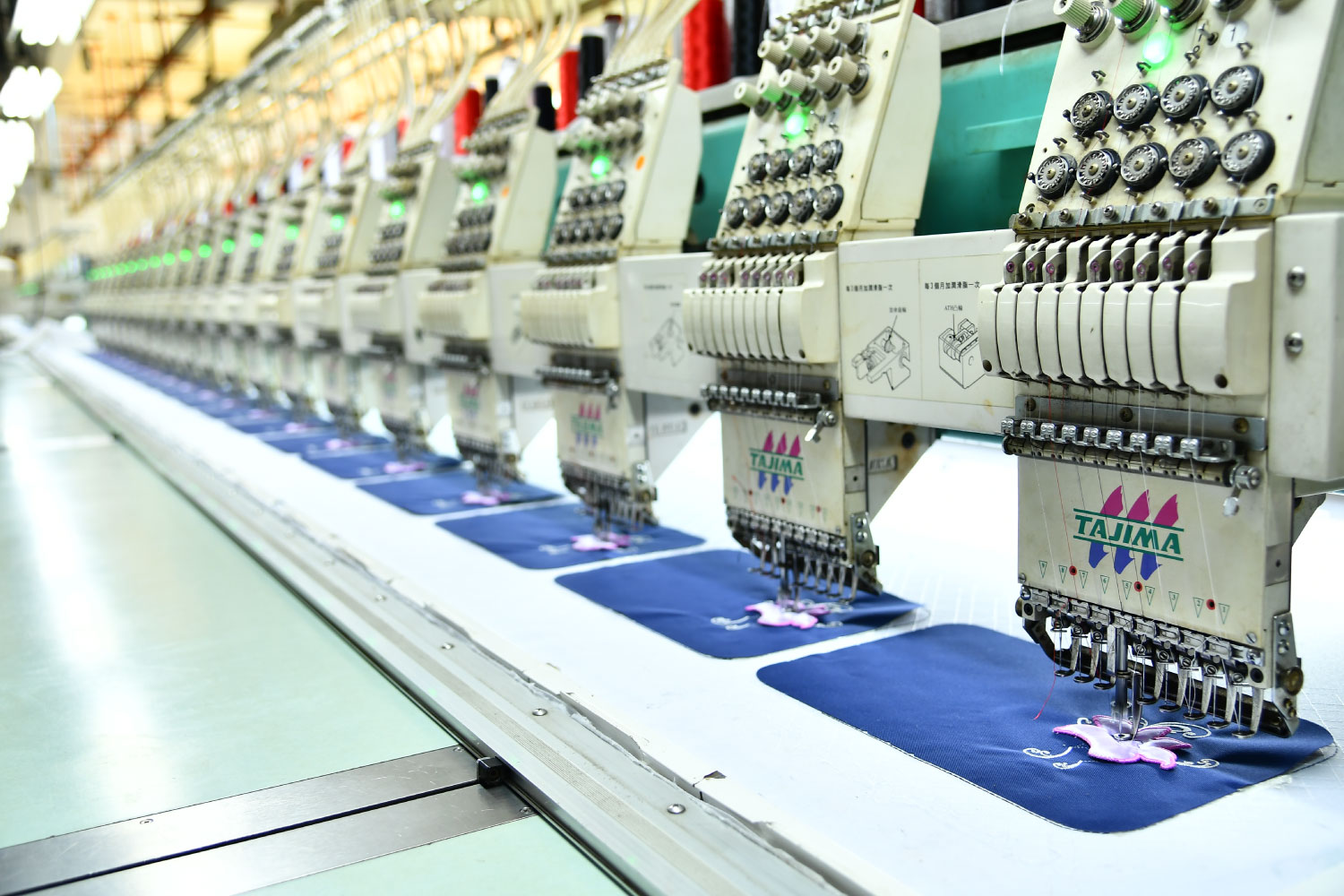 Embroidery machine making part of a bag in Starry factory in China